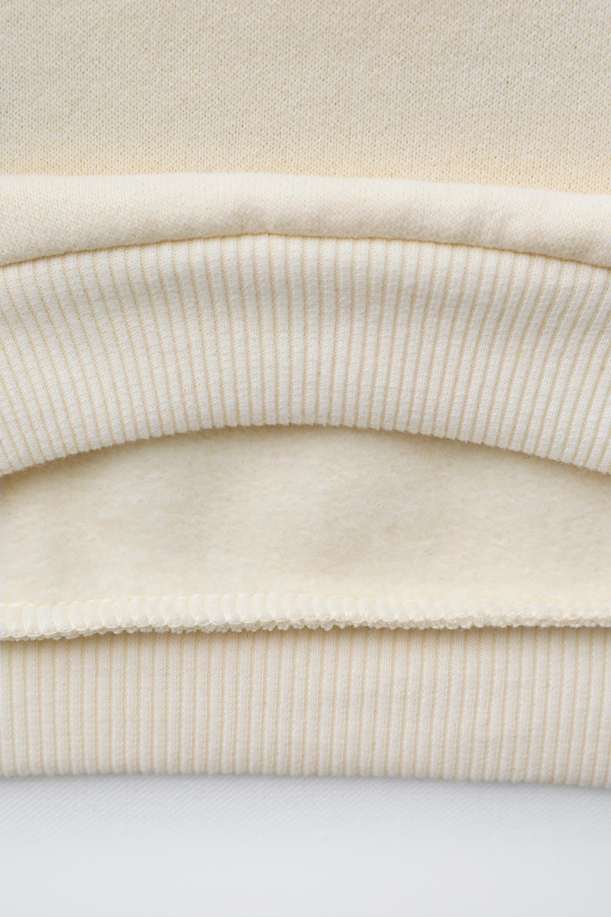 SWEAT À PIÈCES MIFFY™ MERCIS BV ©